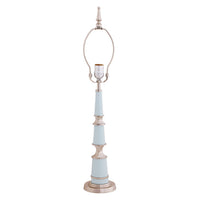 Decorative lamp with a light blue base and white top on a white background
