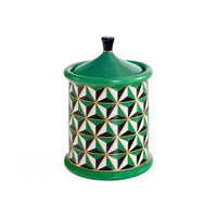 Ceramic jar with geometric pattern and green accents on a white background