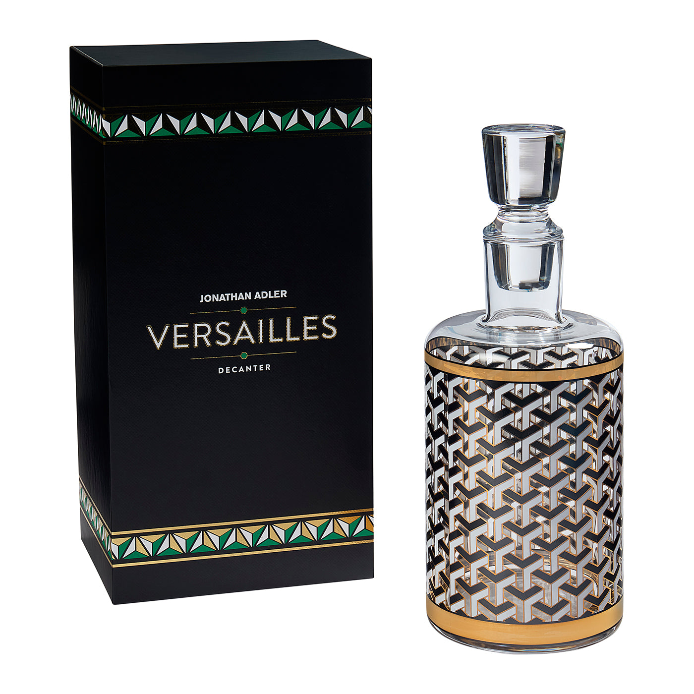 Jonathan Adler Versailles Decanter by Jonathan Adler, featuring a clear glass decanter with a black, white, and gold geometric pattern, shown next to its black presentation box with green and gold accents.