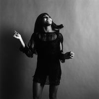 "tina turner, looking up" from getty images - front view